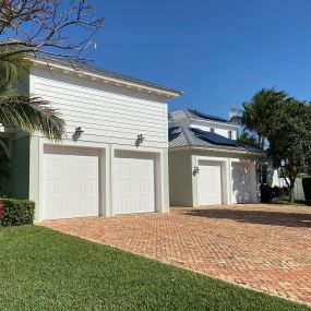 white home with white garage doors