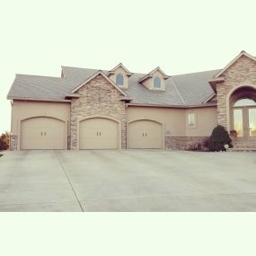 Large residential home with 3 garage doors in Logan