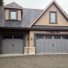 home with a dark-colored garage door