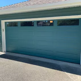 Home with a new blue garage door