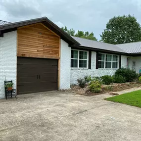 home with a black garage door