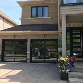 modern home with black garage doors