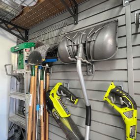 Organizing yard tools is so easy with slatwall and hooks!