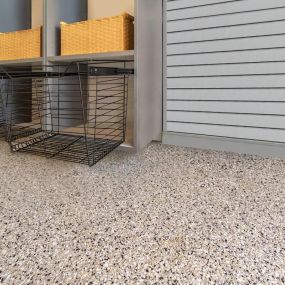 Beautiful epoxy coat flooring completes any garage remodel.