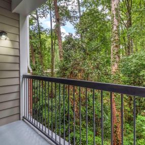Private balcony overlooking picturesque woods