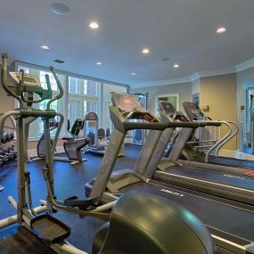 24 hour fitness center with cardio and strength training equipment