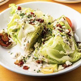 Fall 2022 Wedge salad with crispy bacon, point reyes blue, tomato, ranch