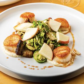 Fall 2022 Seared New England Scallops with Soy braised pork belly, roasted fennel, brussels sprouts, honey crisp apple, creamy celeriac, pine bud syrup