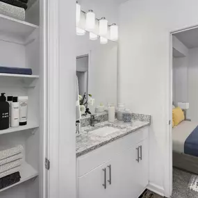 En-Suite Bathroom with Linen Closet and Cabinet Storage