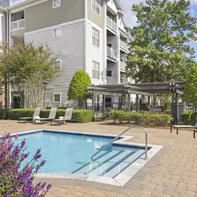 Pool one with sun loungers at Camden Crest Apartments in Raleigh, NC