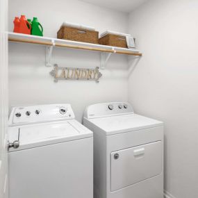 Full size washer and dryer in laundry room