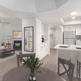 Open-concept dining area near kitchen with white quartz countertops