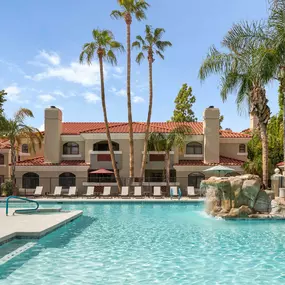 Resort style pool with water feature and sundeck