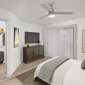 Spacious main bedroom with walk-in closet, ceiling fan and private patio