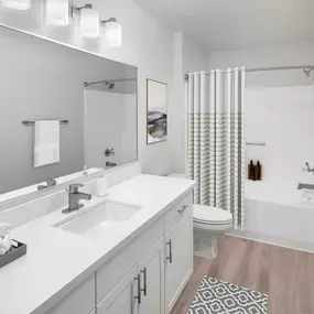 Bathroom with white quartz countertop and brushed nickel fixtures