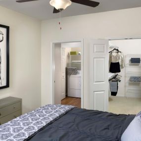 Spacious bedroom with walk-in closet and full-size washer and dryer