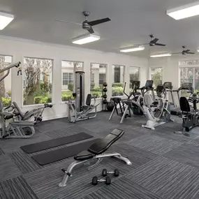 Fitness center with strength training and cardio equipment at Camden Lago Vista apartments in Orlando, Florida.