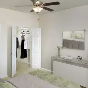 Spacious bedroom with ceiling fan and walk-in closet at Camden Lago Vista apartments in Orlando, FL