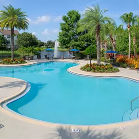 Swimming pool with sundeck, hot tub, and grilling stations