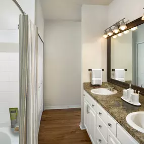 Bathroom with double sink vanity and large soaking bathtub at Camden Lago Vista apartments in Orlando, FL