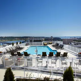 Rooftop swimming pool with views of waterfront scenery