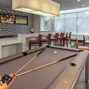 24 hr resident game lounge with pool billiards table flat screen tvs and entertaining kitchen