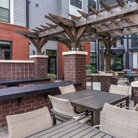 Outdoor dining and bbqs at Camden Gallery Apartments in Charlotte, NC