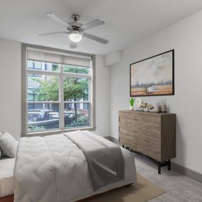 Bedroom with ceiling fan and carpet flooring at Camden Gallery Apartments in Charlotte, NC