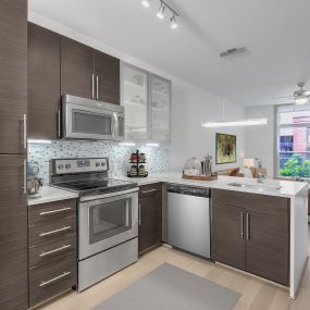 Open-concept kitchen and living room at Camden Gallery Apartments in Charlotte, NC