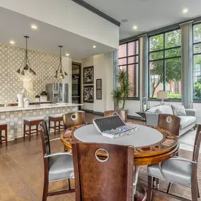 Resident lounge with entertaining kitchen and poker tables at Camden Gallery Apartments in Charlotte, NC