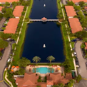 View of lakeside pool surrounded by groomed landscaping