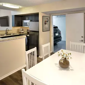 Dining room right off kitchen with open concept floorplan and attached garage