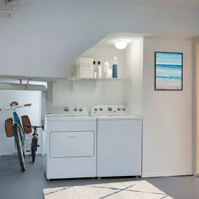 Large garage with full size washer dryer and room for storage