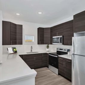 Contemporary style kitchen with stainless steel appliances at Camden College Park in College Park, Maryland