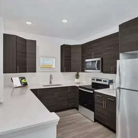 Contemporary style kitchen with stainless steel appliances at Camden College Park in College Park, Maryland