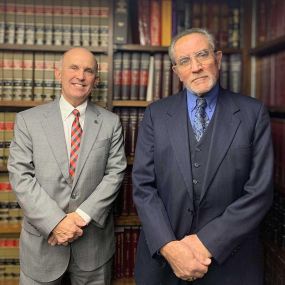 John R. Costello and  Scott B. Baron