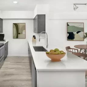 Open concept kitchen and dining in the studio apartment floorplan at Camden Las Olas in Fort Lauderdale, FL.