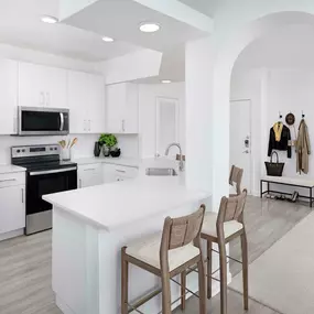 Renovated kitchen with herringbone backsplash at Camden St. Clair in Atlanta GA