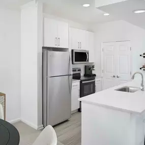 Renovated kitchen with stainless steel appliances at Camden St. Clair in Atlanta GA