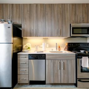 Modern kitchens with stainless steel appliances.