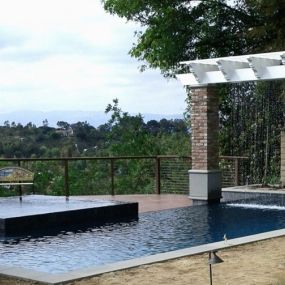 Custom Pool with Spa and Incredible Rain Curtain