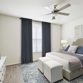 Modern style bedroom with wood style flooring and ceiling fan