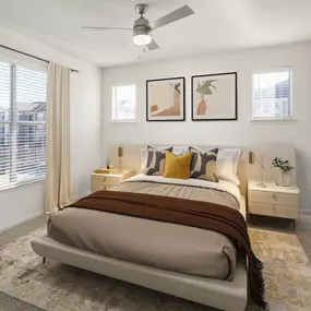 Bedroom with ceiling fan and natural lighting at Camden Spring Creek Apartments in Spring, Texas.