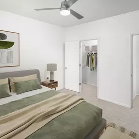 Modern style bedroom with plush carpet and ceiling fan at Camden Spring Creek Apartments in Spring, Tx
