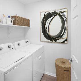 Camden Montierra Apartments Scottsdale AZ full size washer and dryer with wooden shelves and flooring