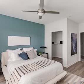 Bright bedroom with a ceiling fan at Glen Oaks Apartments in Wall Township, NJ.