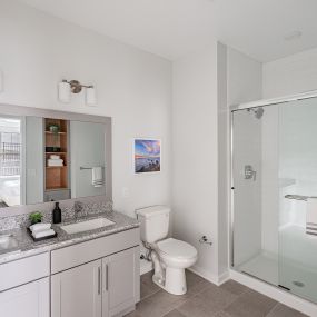 Bathroom with double sinks at Glen Oaks Apartments in Wall Township, NJ.