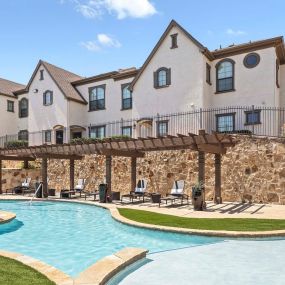 Resort-style pool with cabana seating at Camden Brushy Creek apartments in Austin, TX