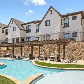 Resort-style pool with cabana seating at Camden Brushy Creek apartments in Austin, TX