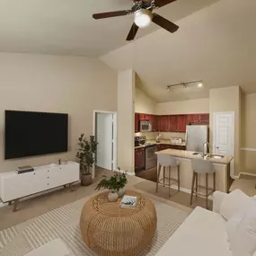Living room, kitchen, and dining area with vaulted ceilings at Camden Brushy Creek apartments in Cedar Park, TX